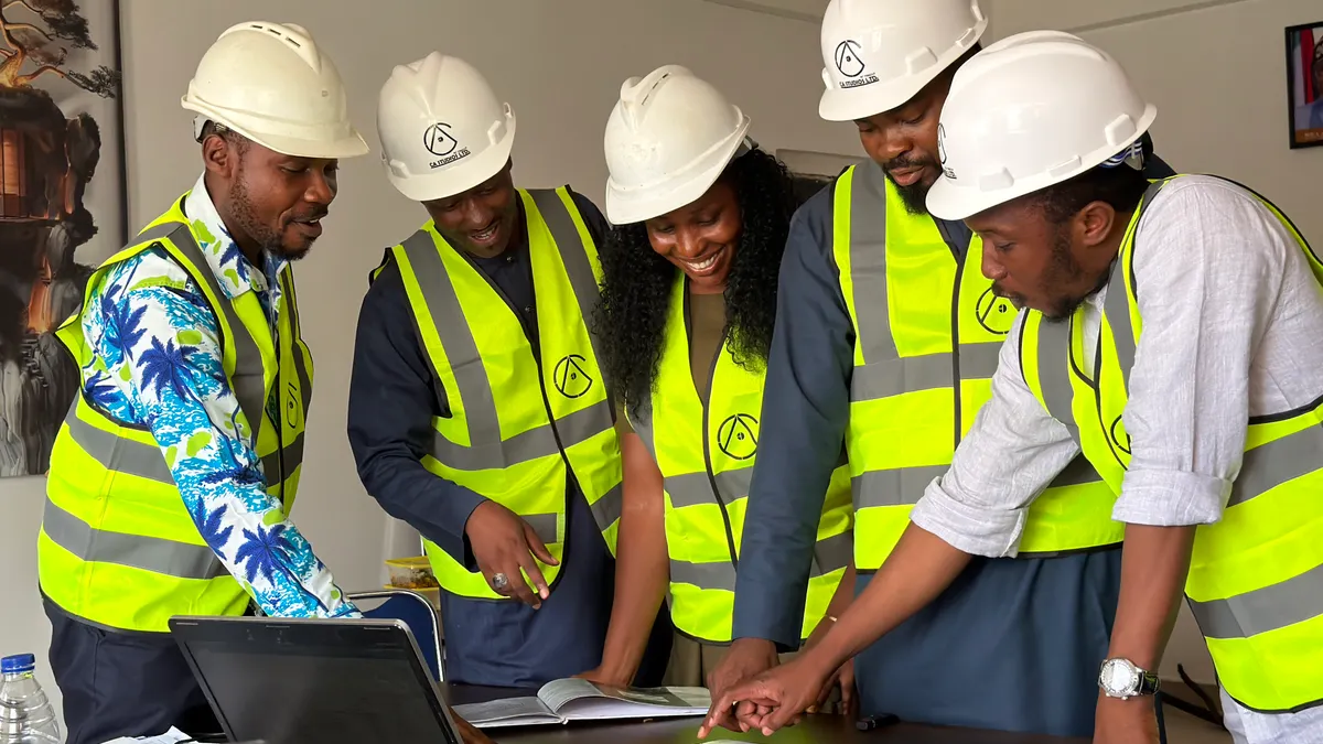 Preconstruction planning and site readiness — The Complete Guide group of workers in hard hats studying plans