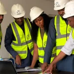 construction team reviewing site plans together
