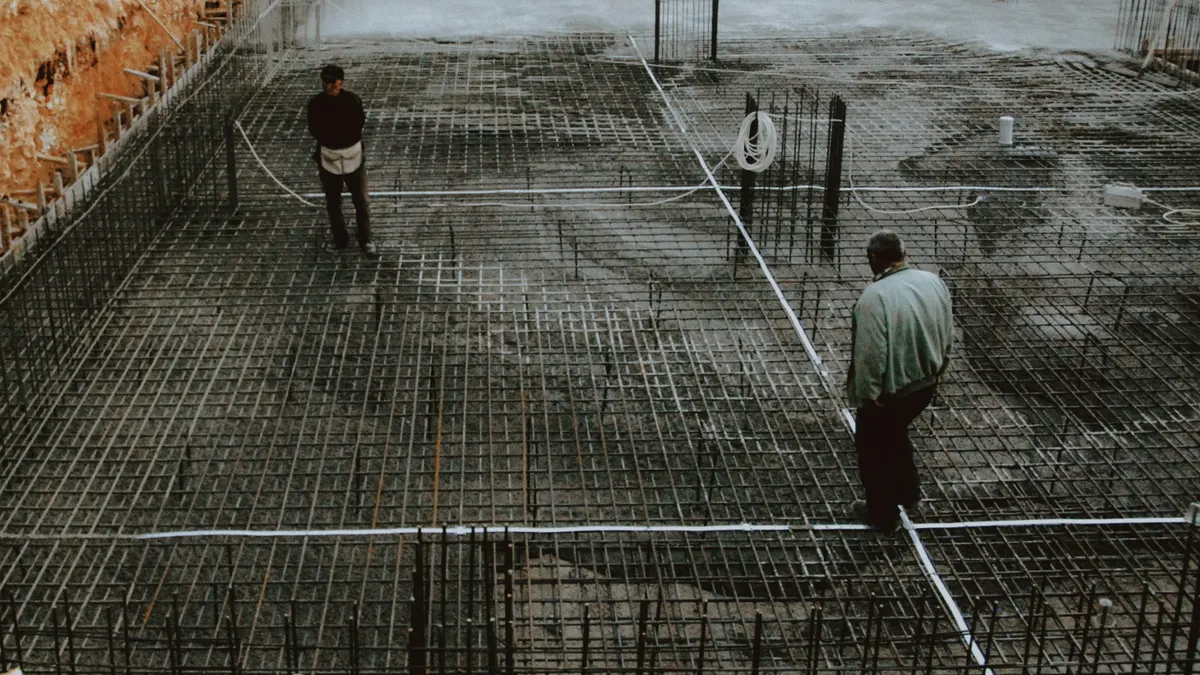 workers on a rebar slab under construction